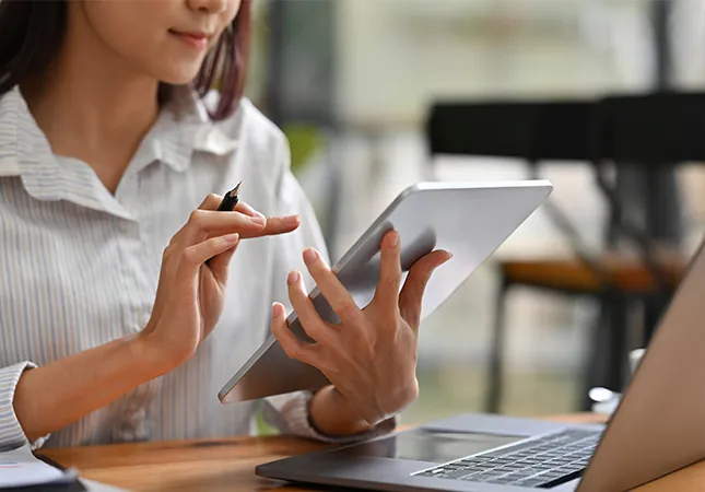A woman using a tablet computer.