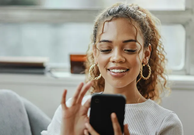 A woman using a mobile phone.