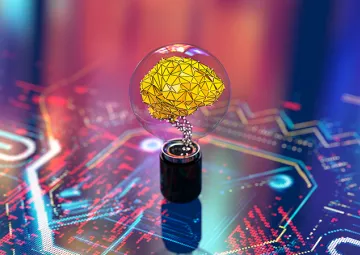 A lightbulb on a circuit board with a neural network inside it.