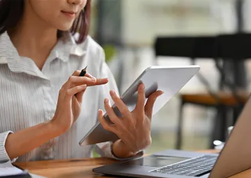 A woman using a tablet computer.