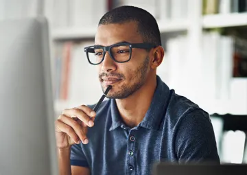 A man working at a computer.
