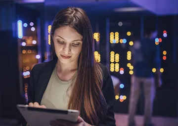 A woman using a tablet computer.