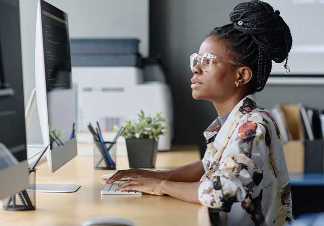 Image of a woman doing computer programming