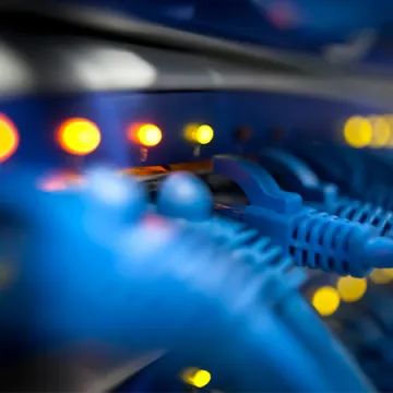 Network cables plugged into a device.